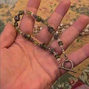 Extra long green beaded bracelet.